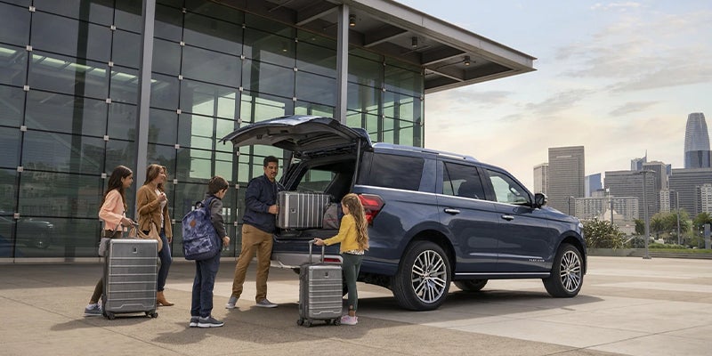 A 2023 Ford Expedition being packed by a family.